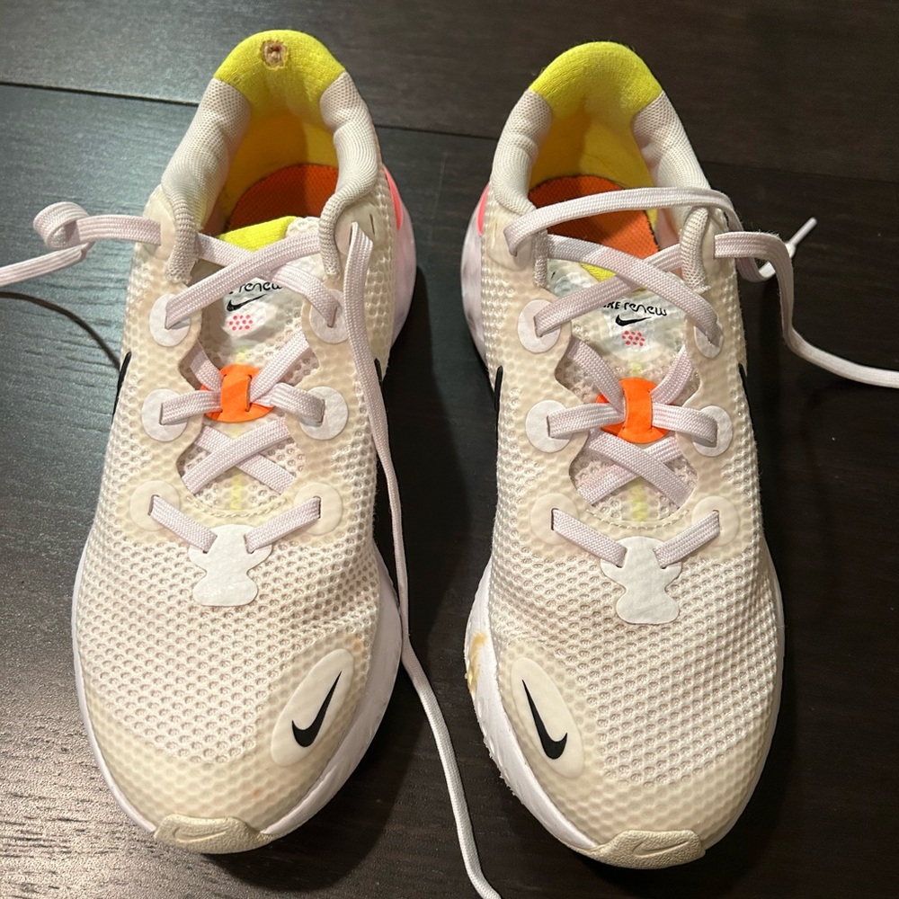 Women’s White with orange Nike renew running shoe